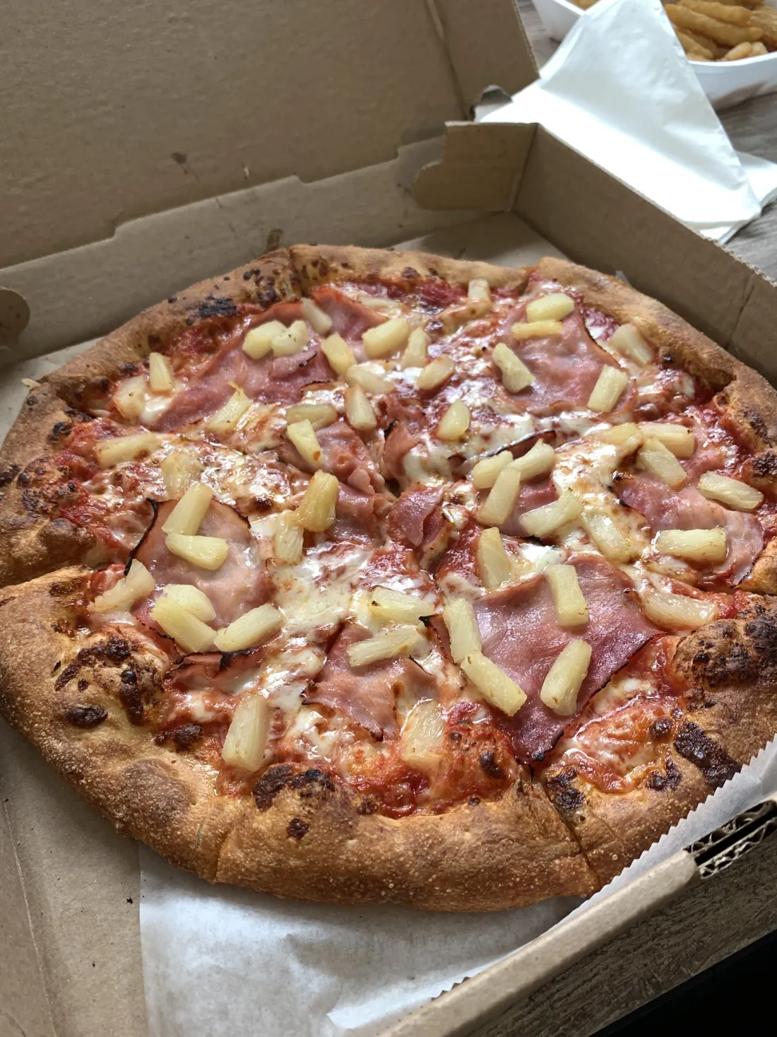 Hawaiian pizza with ham and pineapple